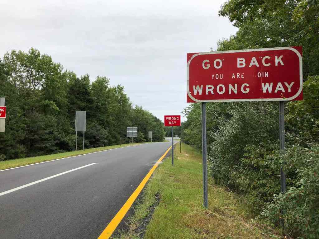 Old "Go Back - You Are Going Wrong Way" sign on a ramp from westbound New Jersey State Route 446 (Atlantic City Expressway) to Camden County Route 536 Spur (Williamstown Road) in Winslow Township, Camden County, New Jersey