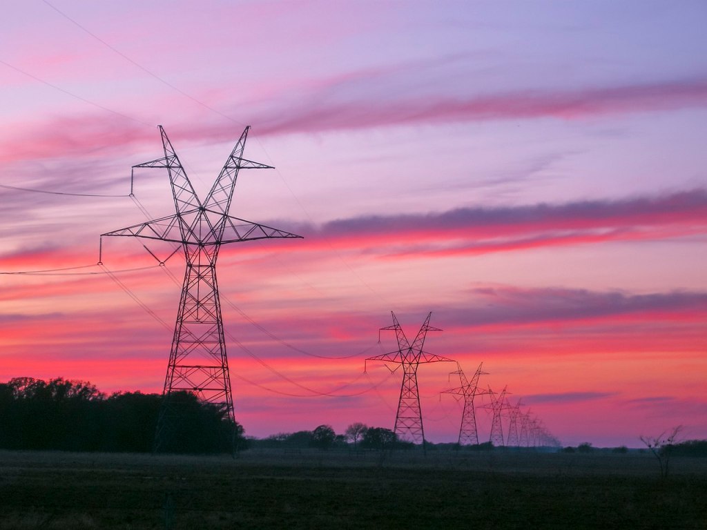 Transmission towers and lines at sunset in East Texas